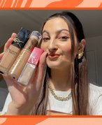 alanna holding up her favorite concealers with skin benefits from ysl beauty, valentino beauty and urban decay