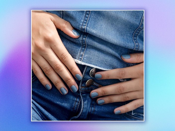 Close-up picture of denim nails on a blue gradient graphic background