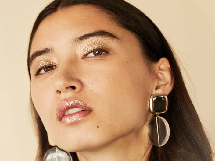 person wearing glitter eye and lip makeup