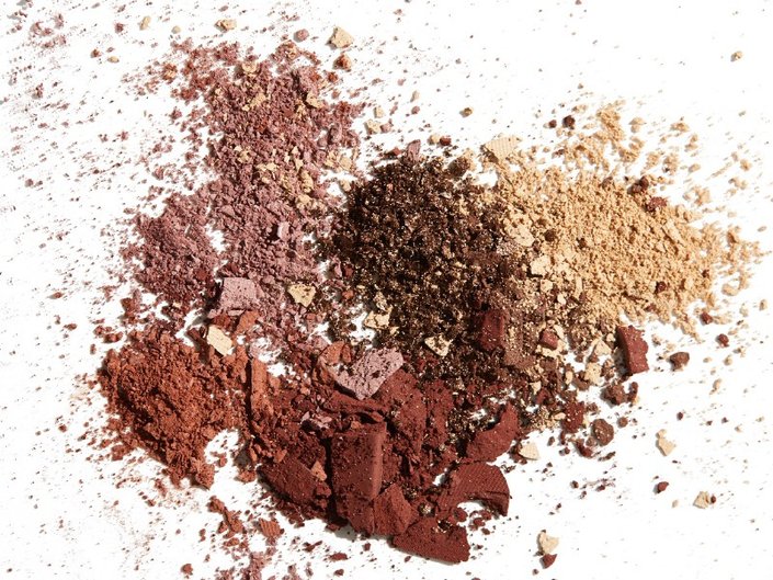 powder makeup spilled on white background