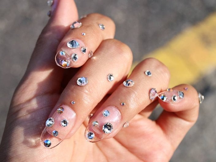 hand with large crystals on nails