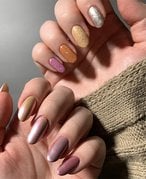 A person with multi-colored nails