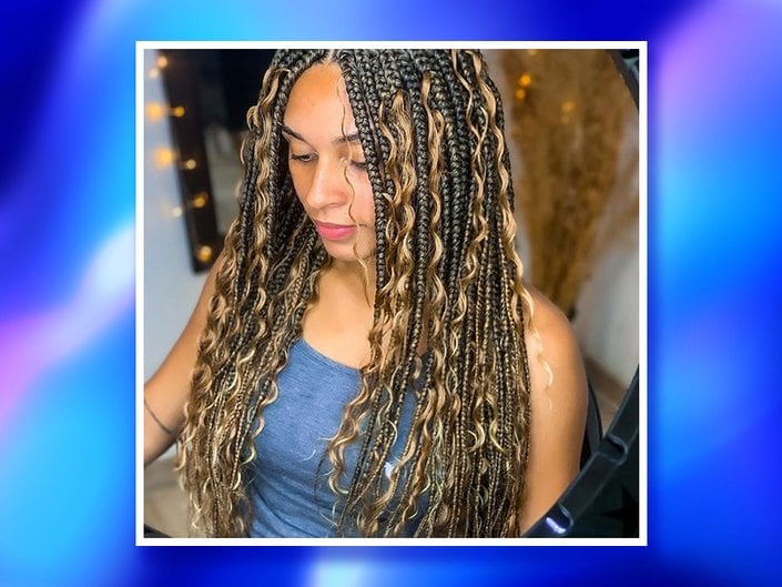 Picture of a person with knotless goddess braids with a blue gradient graphic border.