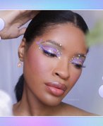 Person wearing a lavender and pearl embellished eyeshadow look. 