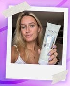 Photo of an editor with long blonde hair holding up the Redken Acidic Bonding Concentrate 5-Min Liquid Mask Review, collaged on a purple graphic background