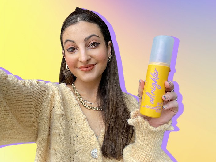 person holding urban decay all nighter setting spray with vitamin C