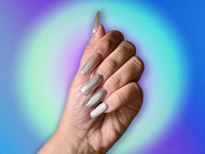Photo of long silver velvet nails collaged on a blue and green background