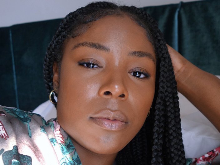 close up image of someone's face with little minimal makeup on